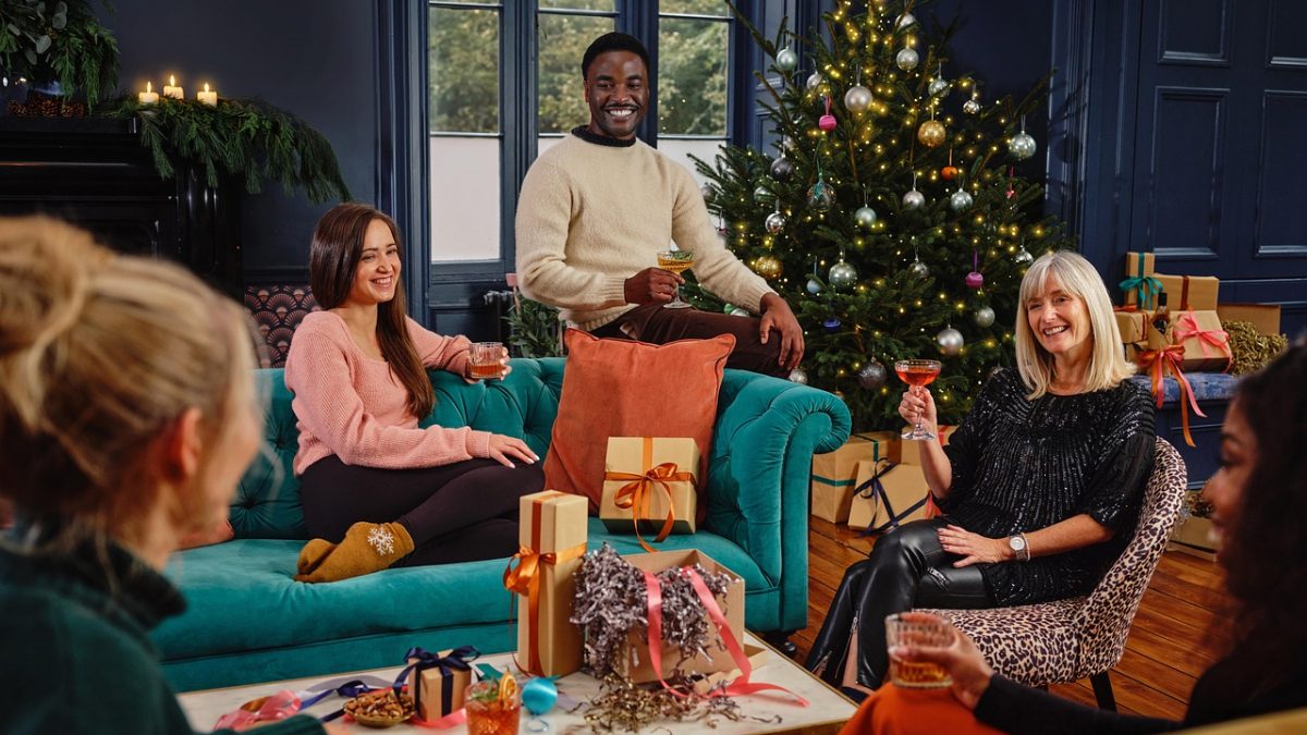 people around a christmas tree