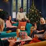 people around a christmas tree