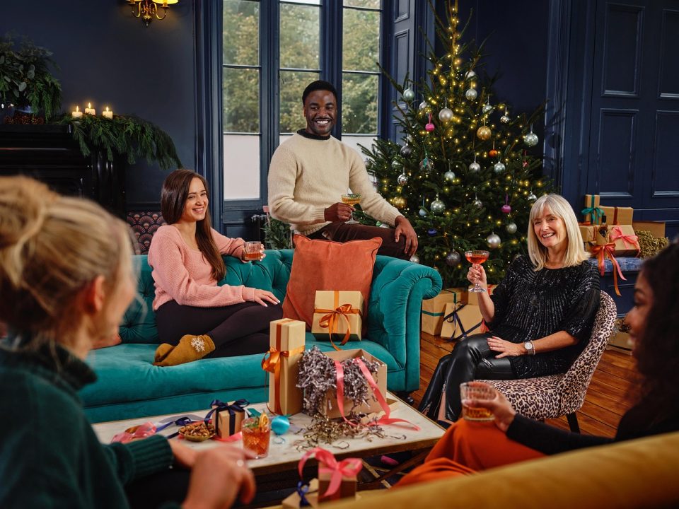 people around a christmas tree